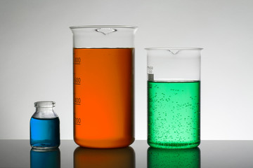 Liquid in laboratory bottles. Scientific biochemical laboratory. Colorful liquid.