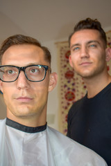 man with fresh haircutt  is posing with the creator