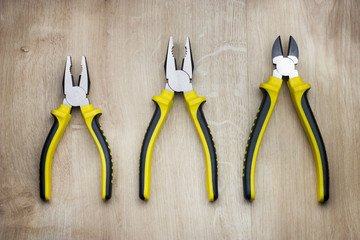 Yellow combination pliers and side cutters