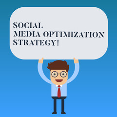Writing note showing Social Media Optimization Strategy. Business photo showcasing SEO Advertising Marketing strategies Man Standing Holding Above his Head Blank Rectangular Colored Board