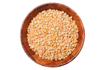 Dry split peas in wooden bowl isolated on white. Empty copy space food background in studio.