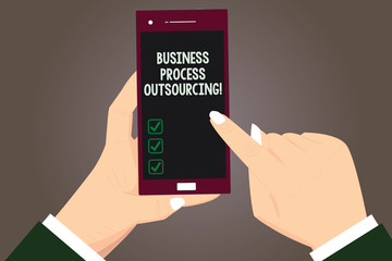 Word writing text Business Process Outsourcing. Business concept for Contracting work to external service provider Hu analysis Hands Holding Pointing Touching Smartphone Blank Color Screen