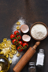 Ingredients for cooking pasta. Kitchen process. Top view with space for text.