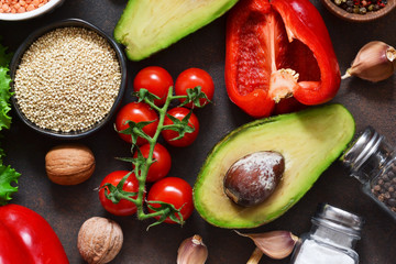 Fresh, raw vegetables on the kitchen table. Health food, clean food, choice: fruits, vegetables, seeds, superfoods, cereals, leafy vegetables. Ingredients for cooking. Top view.