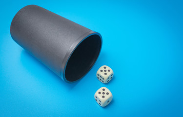 two game dice number double five on a blue background