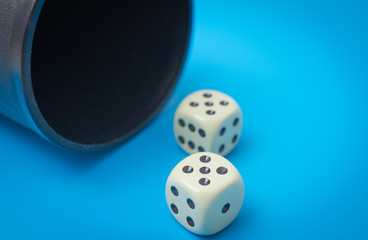 two game dice number double five close up on a blue background