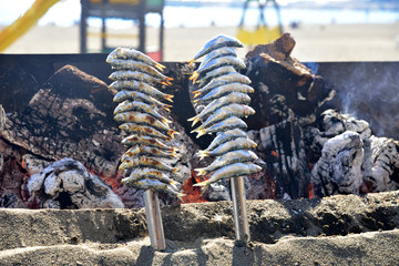 Grilled seafood on a coal hearth. © konik60