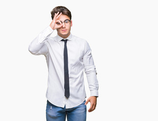 Young business man wearing glasses over isolated background doing ok gesture with hand smiling, eye looking through fingers with happy face.
