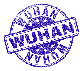 WUHAN stamp seal imprint with grunge texture. Designed with rounded rectangles and circles. Blue vector rubber print of WUHAN title with retro texture.