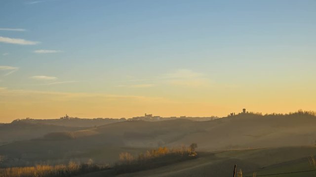 Panoramic view of a sunset on the Alps from a hill in the Montferrat