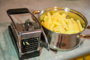 French Fries Cutting machine, manual potato cutter slicer. The process of cooking french fries