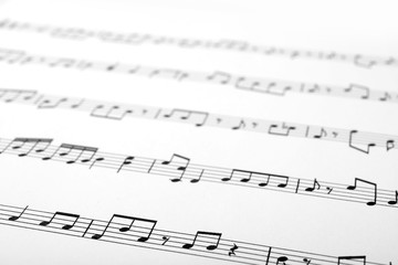 Fototapeta premium Sheet with music notes as background, closeup