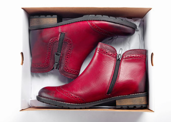 New beautiful fashion pink shoes in box in store on shelf