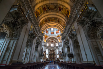 Obraz premium Salzburg, Austria - October, 07, 2018 - Tourists visit the interior of the Salzburg Cathedral.