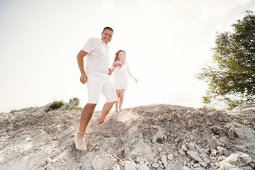 Happy young romantic couple in love have fun on beautiful beach.
