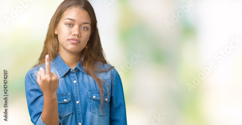 Young Beautiful Brunette Woman Wearing Blue Denim Shirt Over