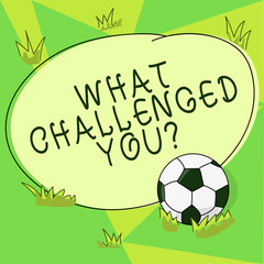 Conceptual hand writing showing What Challenged You. Business photo showcasing call someone to participate in competitive situation Soccer Ball on the Grass and Blank Round Color Shape photo
