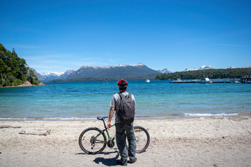 Fototapeta premium young cyclist looking at the sea