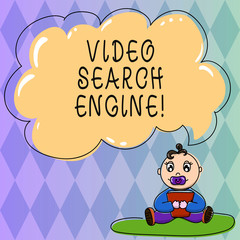 Text sign showing Video Search Engine. Conceptual photo which crawls web deeply for media and audio content Baby Sitting on Rug with Pacifier Book and Blank Color Cloud Speech Bubble