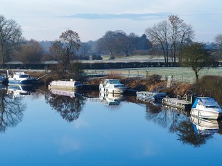 Boats on the River Ouse near York, England, on a clear frosty morning