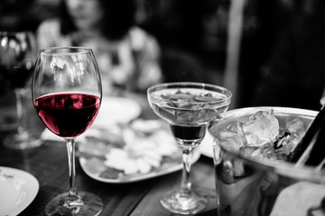 black and white glass of red wine