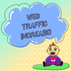 Handwriting text Web Traffic Increase. Concept meaning Growth of the amount of web users who visit a website Baby Sitting on Rug with Pacifier Book and Blank Color Cloud Speech Bubble