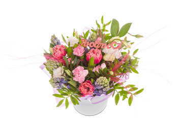 Bright buketny composition from fresh flowers, the white isolated background
