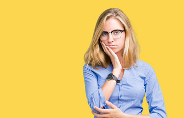 Beautiful young business woman over isolated background thinking looking tired and bored with depression problems with crossed arms.