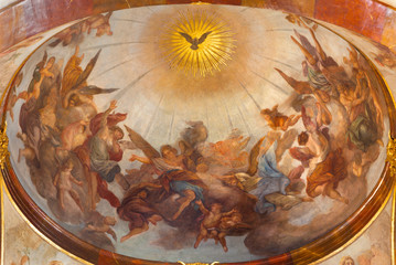 PRAGUE, CZECH REPUBLIC - OCTOBER 12, 2018: The ceiling fresco of Holy Spirit among the angels in St. Francis of Assisi church by Jan Kryštof Liška (1650 - 1712).