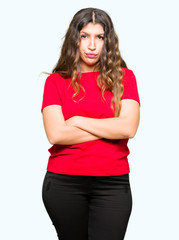 Young beautiful woman wearing casual t-shirt skeptic and nervous, disapproving expression on face...