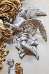 PRAGUE, CZECH REPUBLIC - OCTOBER 12, 2018: The carved polychrome baroque statue of angel from the...