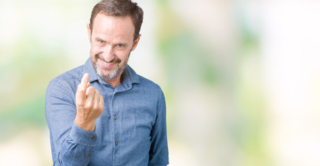 Handsome middle age elegant senior man over isolated background Beckoning come here gesture with hand inviting happy and smiling