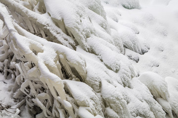 Frozen tiered waterfall covered in beautiful ice formations
