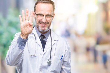 Middle age senior hoary doctor man wearing medical uniform isolated background showing and pointing up with fingers number four while smiling confident and happy.