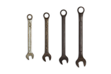 Old combination wrenchs on white background