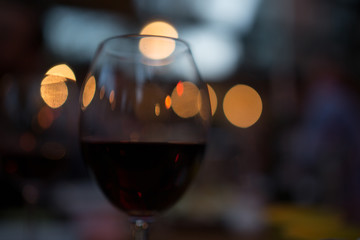 bokeh night glass of red wine valentines day