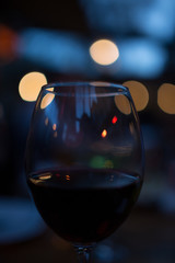 bokeh night glass of red wine valentines day