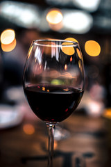 bokeh night glass of red wine valentines day