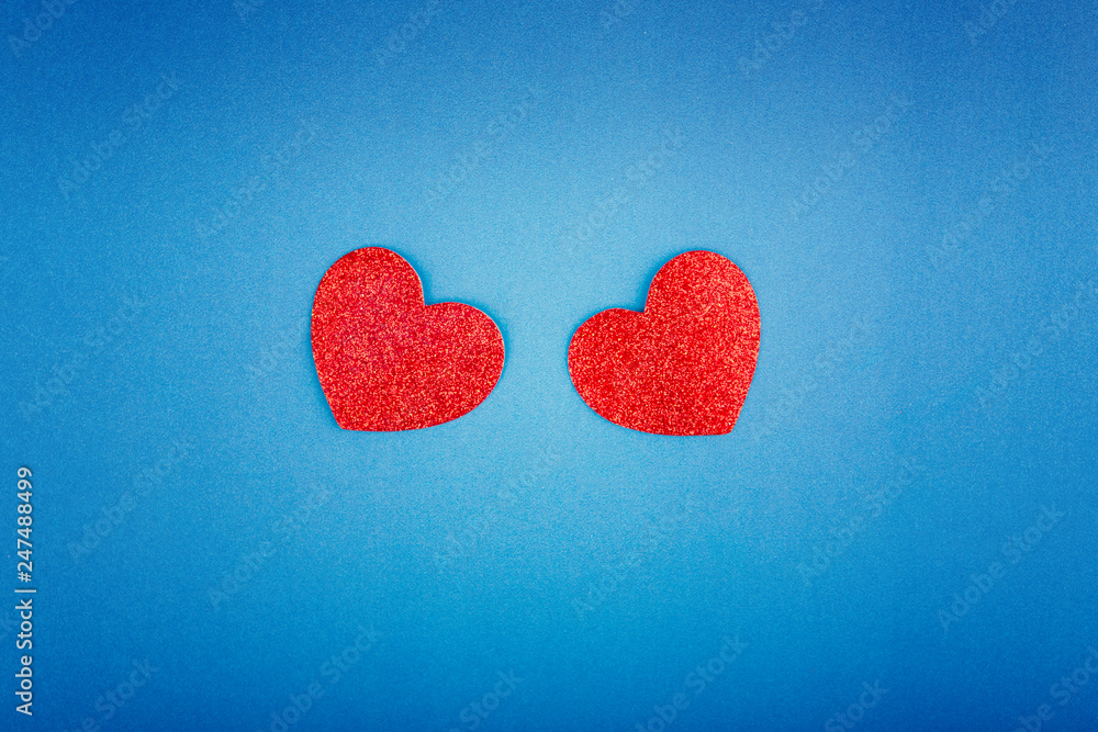 Wall mural happy valentine day. beautiful card wallpaper with two red hearts in centre on blue background. grad