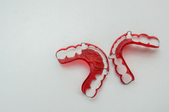 Isolated top view of red retainer for women health