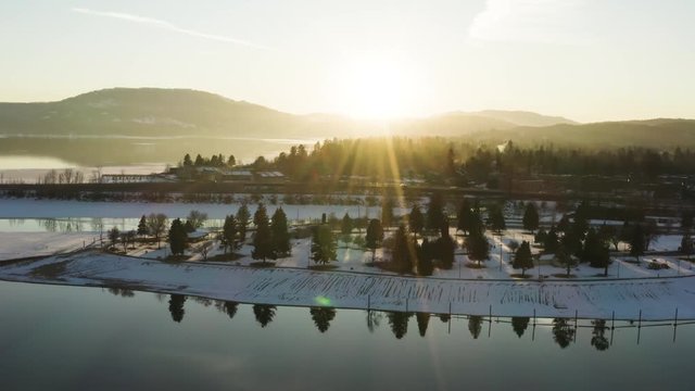 Sun Flare Aerial Snow Winter Waterfront Lake Pend Oreille Sandpoint Idaho USA