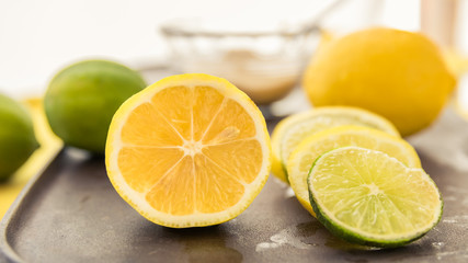 A Juicy Lemon Half with Lemon and Lime Slices