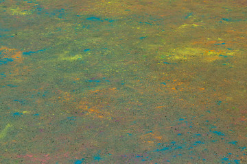 Background of colorful Holi powder on the ground