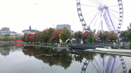 Twilight view of the beautiful fall color with the La Grande Roue de Montreal observation ferris wheel