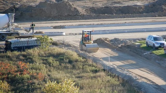 Road Roller Backing Up On Construction Site 4K