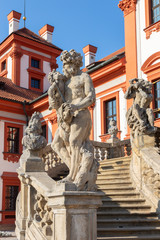 Fototapeta na wymiar PRAGUE, CZECH REPUBLIC - OCTOBER 16, 2018: The statue of Cronos on the stairs of baroque palace Trojsky zámek by Georg a Paul Heermann (1685).