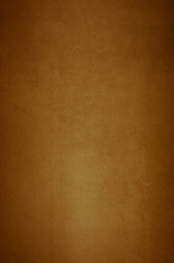 Background wall of aged textured old plaster brown.