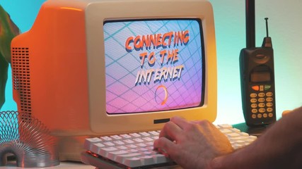 Waiting for the vintage computer to connect to the Internet. 80s 90s style concept.