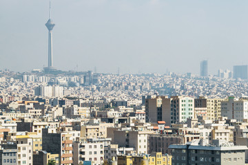 Fototapeta na wymiar View of Milad Tower and residential buildings. Tehran skyline
