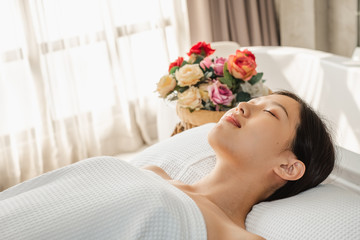 Obraz na płótnie Canvas Young Asian beauty woman enjoying massage and spa